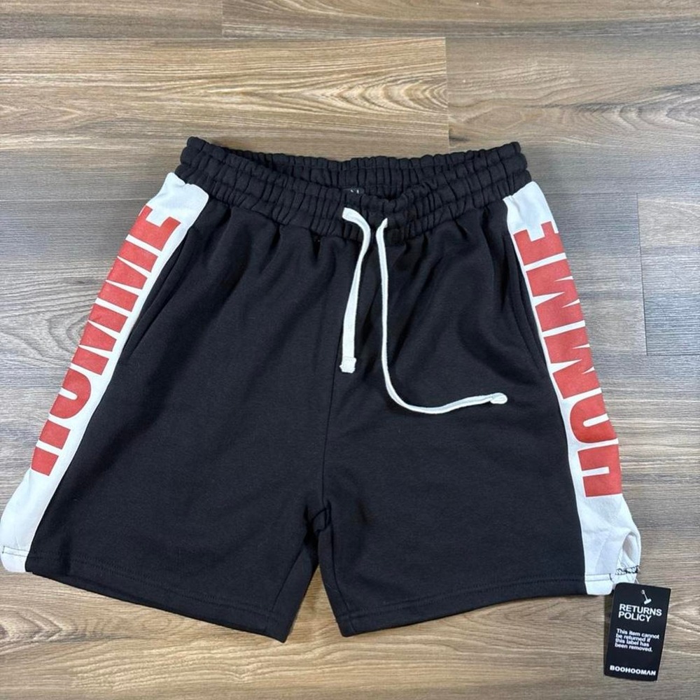 BoohooMAN black shorts with white side panels and red 'HOMME' text, size M